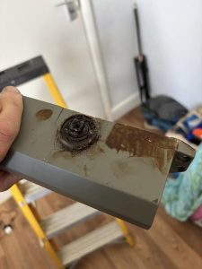 Rusty and old fire door closer component