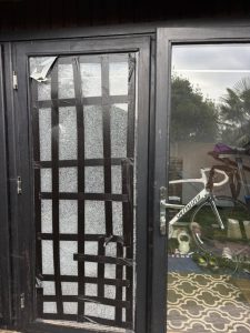 Boarded up glass door panel