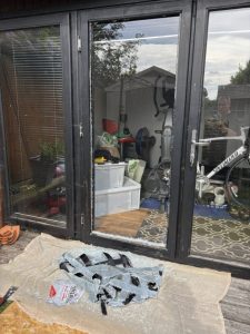 Image of a glass pane with debris on the floor