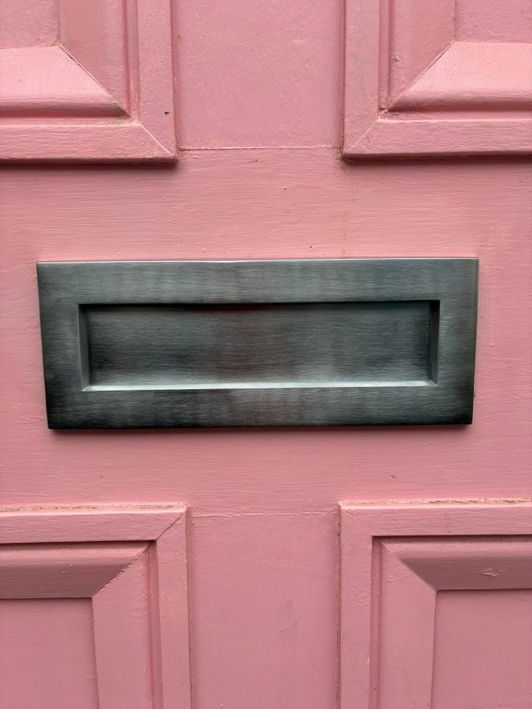 Letterbox installation for a wooden door in Brighton
