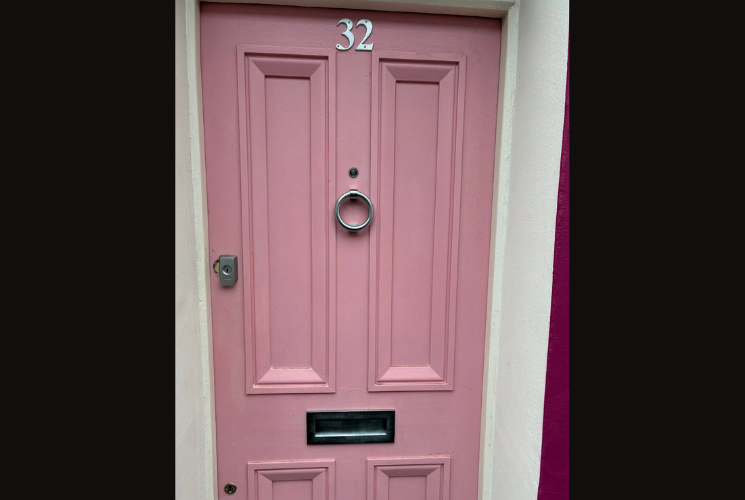Pink wooden door with door lock and furnishings by ASL Locksmiths Brighton