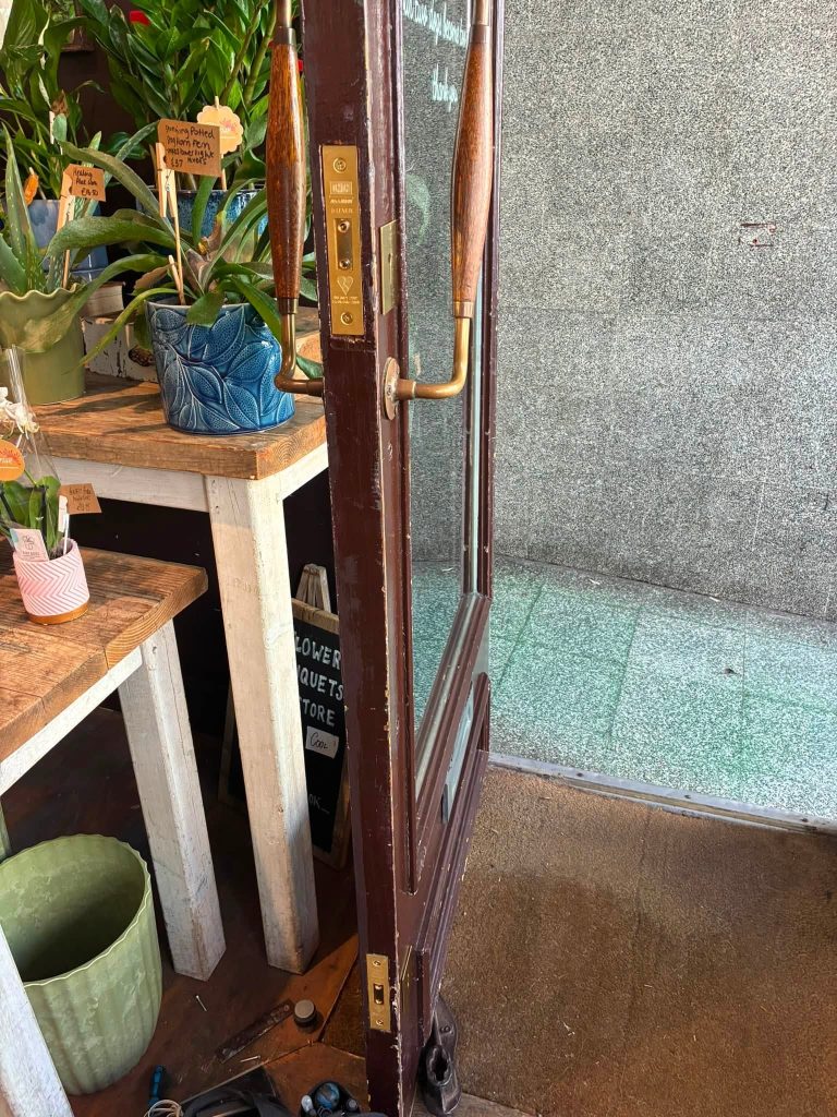 Two keyed-alike Union brass deadlocks installed on a commercial shop door in Brighton by ASL Locksmiths.